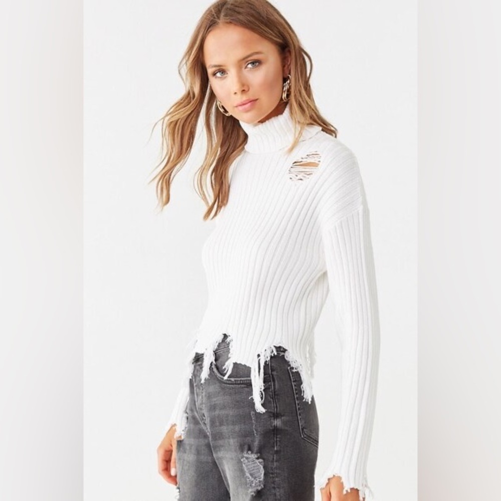 Distressed white sweater